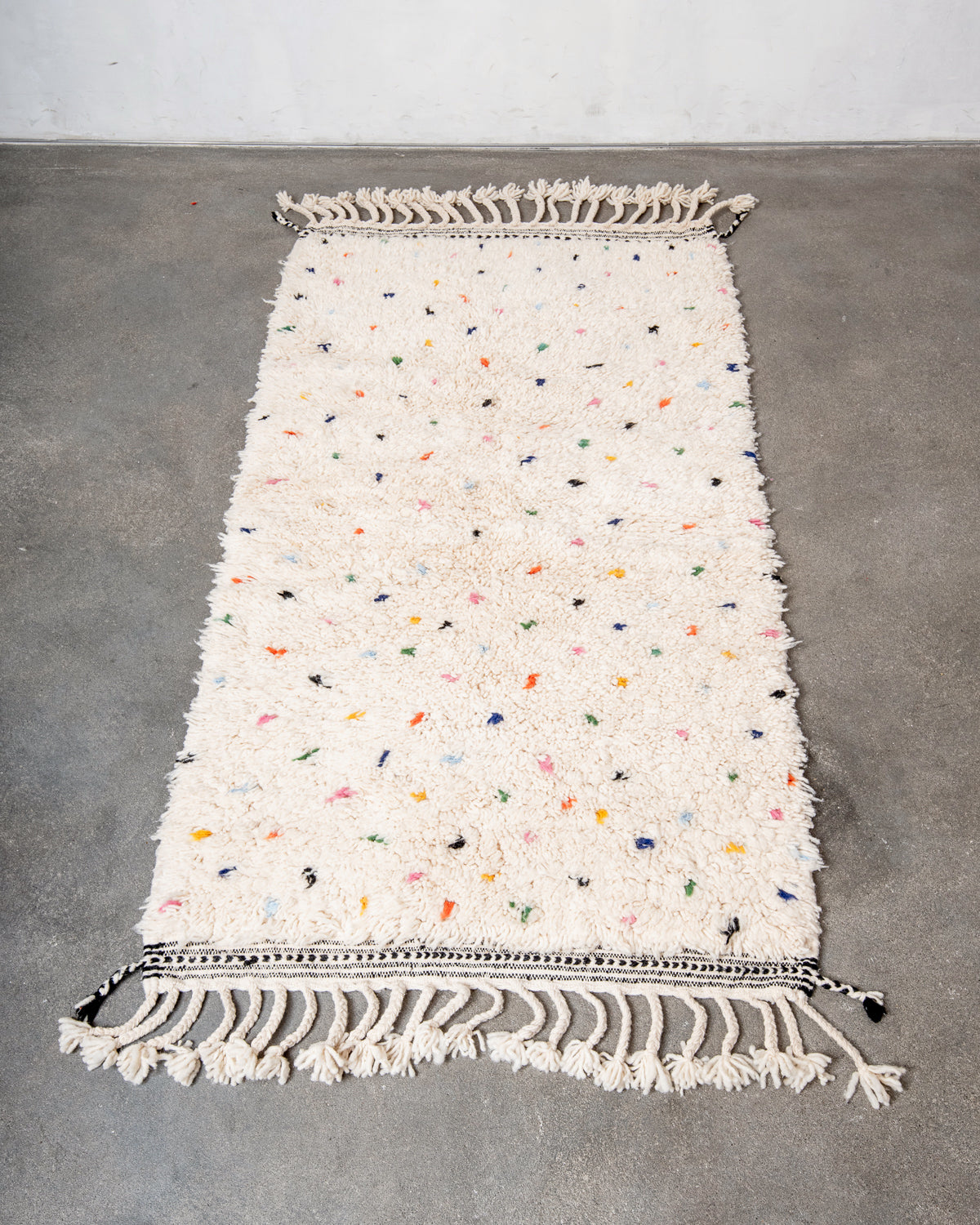 Modern, designer, handcrafted Berber rug from Morocco. Beniourain carpet with beautiful colours and patterns and fluffy wool texture.